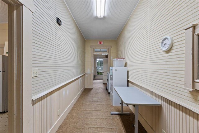 315 W Green St, Perry, FL 32347 - hall with light colored carpet and wood walls