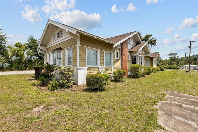 315 W Green St, Perry, FL 32347 - view of property exterior with a yard