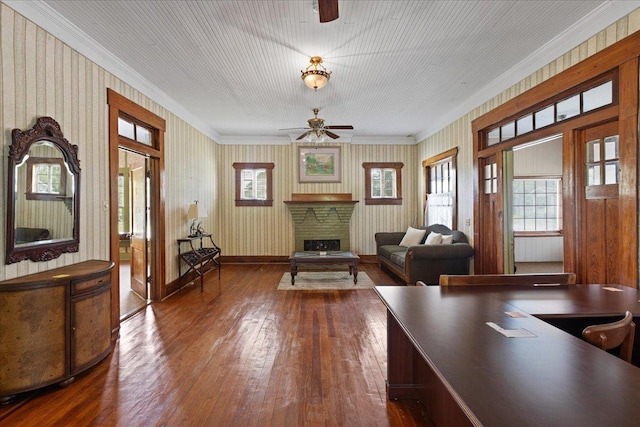 315 W Green St, Perry, FL 32347 - living room featuring ceiling fan, ornamental molding, hardwood / wood-style floors, and a fireplace