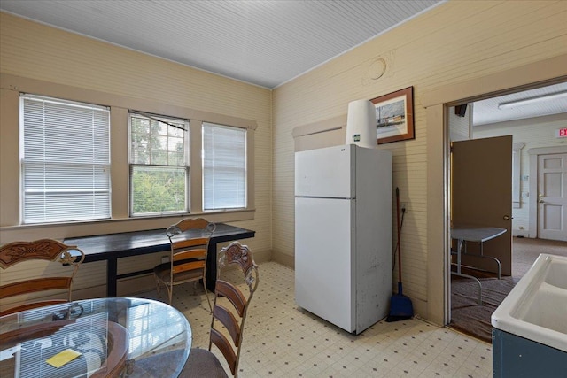 315 W Green St, Perry, FL 32347 - kitchen with freestanding refrigerator and light floors