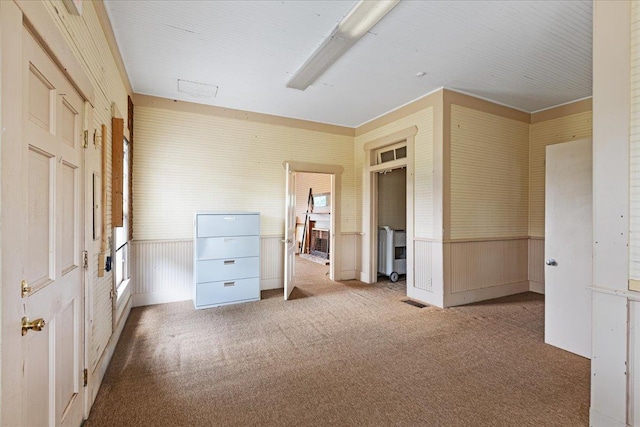 315 W Green St, Perry, FL 32347 - unfurnished bedroom with carpet floors and a wainscoted wall