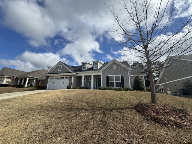 view of front of house featuring a front yard and a garage