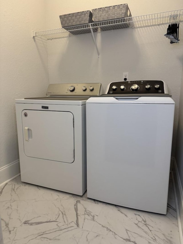 laundry area featuring washer and clothes dryer