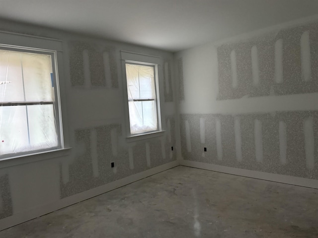 953 Cap Tram Rd, Tallahassee, FL 32317 - empty room with concrete flooring and plenty of natural light