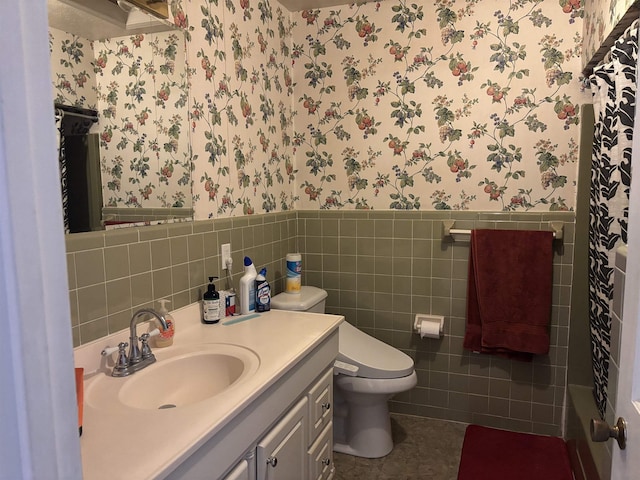 bathroom with vanity, tile patterned floors, tile walls, and toilet