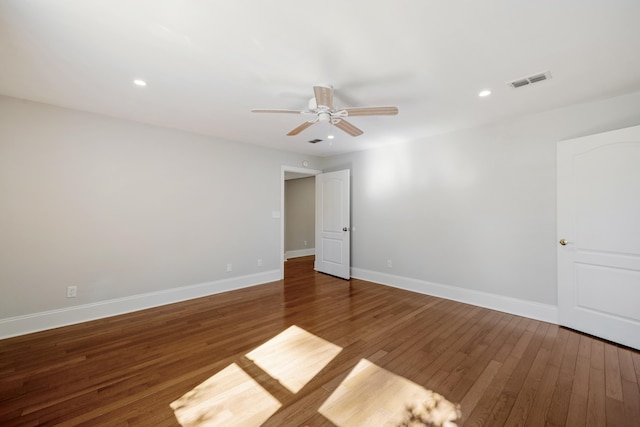 empty room featuring ceiling fan, recessed lighting, wood finished floors, visible vents, and baseboards