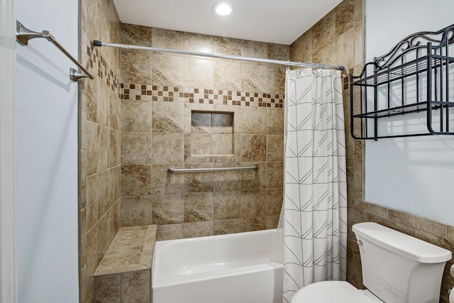 bathroom with toilet and shower / bath combo