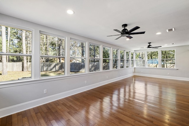 interior space with recessed lighting, visible vents, baseboards, and wood finished floors