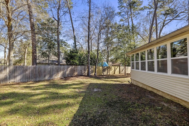 view of yard with a fenced backyard