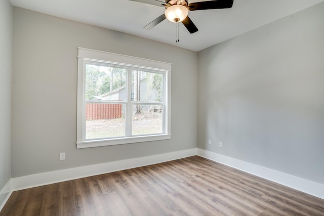 unfurnished room with ceiling fan and light wood-type flooring