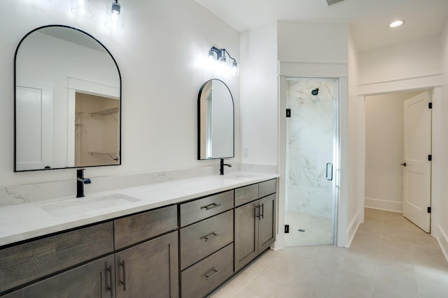 bathroom featuring vanity, tile patterned floors, and an enclosed shower