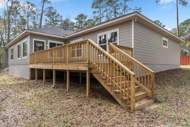 back of house featuring a wooden deck