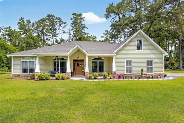 459 Oakwood Trl, Crawfordville, FL 32327 - view of front facade featuring a front yard and stone siding