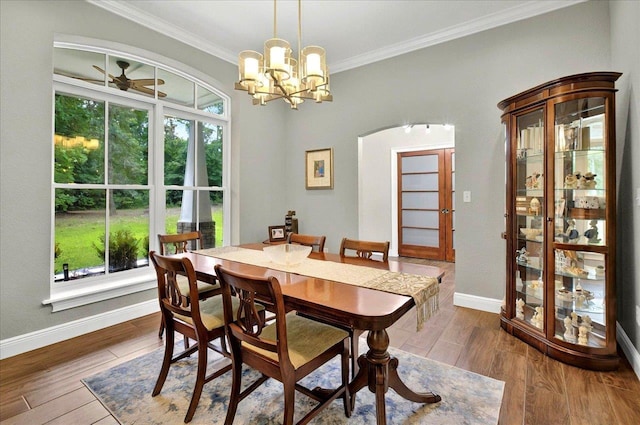459 Oakwood Trl, Crawfordville, FL 32327 - dining area featuring crown molding, wood finished floors, ceiling fan, and a chandelier