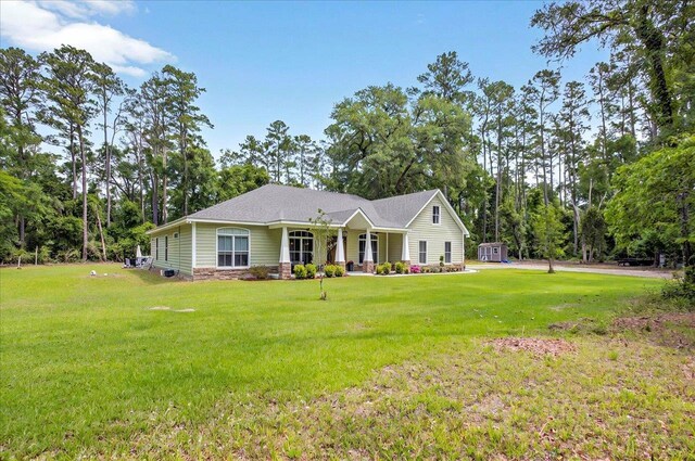 459 Oakwood Trl, Crawfordville, FL 32327 - single story home with a front lawn and a storage shed