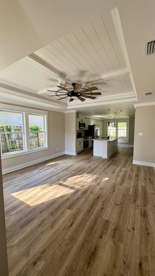unfurnished living room with crown molding, wooden ceiling, light wood-style flooring, and ceiling fan