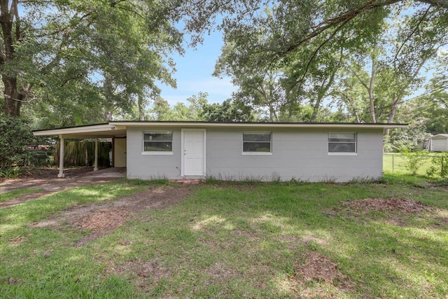 2014 Coffee Ln, Tallahassee, FL 32303 - view of front facade featuring a carport and concrete block siding