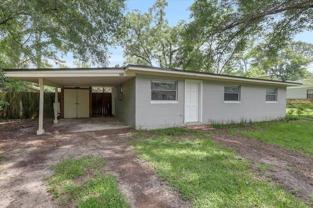 2014 Coffee Ln, Tallahassee, FL 32303 - ranch-style house featuring dirt driveway and a carport