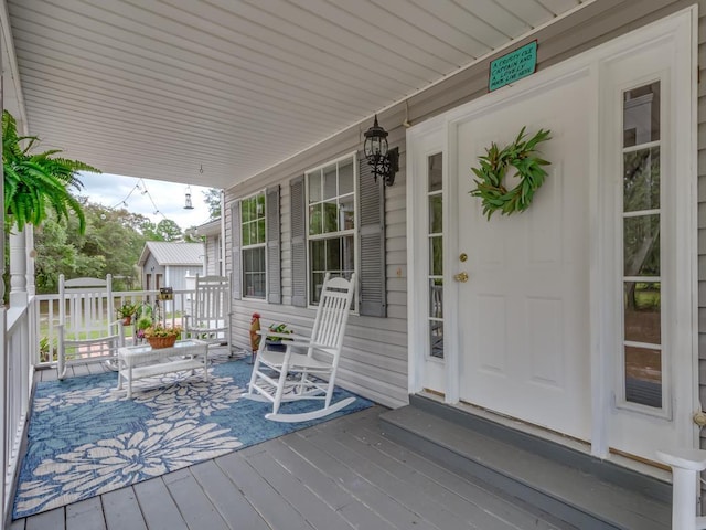 wooden terrace with a porch