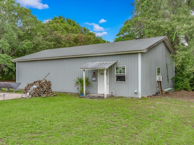 view of outbuilding featuring a lawn