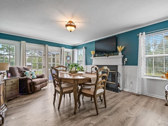 dining space with wood-type flooring