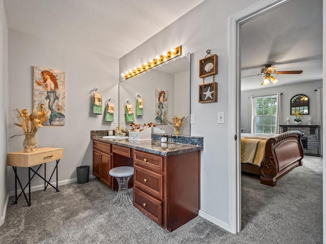 bathroom with ceiling fan and vanity