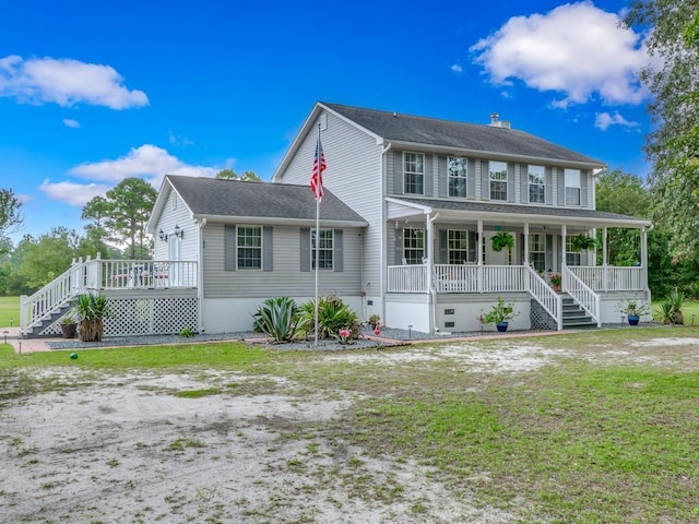 view of front of property featuring covered porch and a front lawn