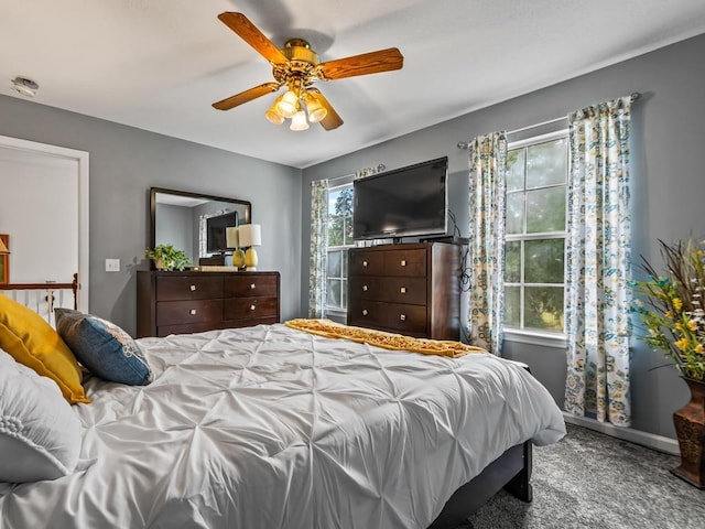 carpeted bedroom with ceiling fan