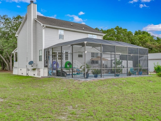 back of property with a pool, a yard, a lanai, and a patio