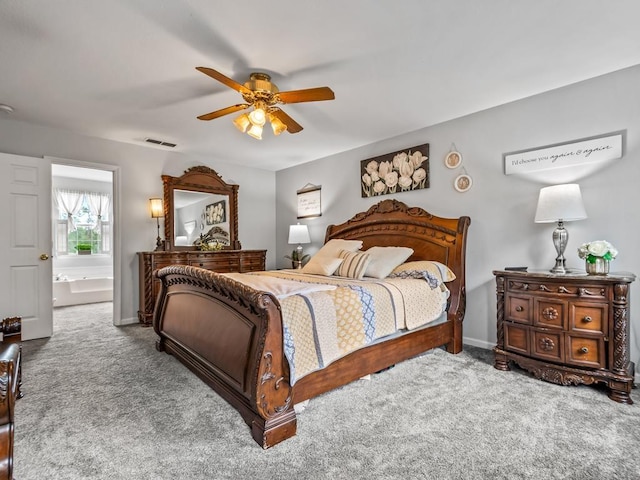 carpeted bedroom featuring ensuite bathroom and ceiling fan