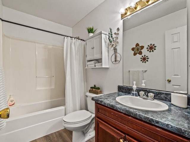 full bathroom with vanity, hardwood / wood-style floors, shower / bath combination with curtain, and toilet