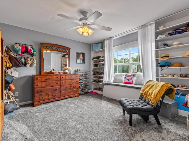 interior space featuring ceiling fan and carpet flooring