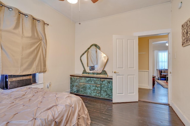 bedroom with dark wood finished floors