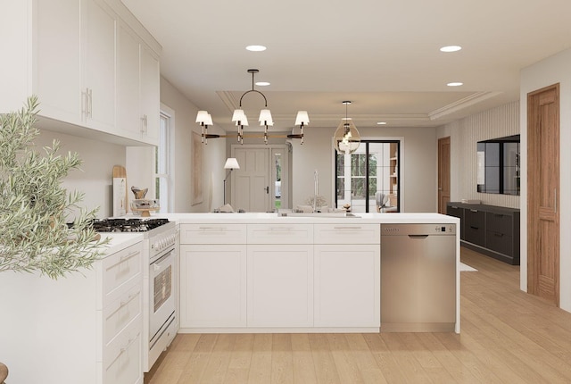 606 Hampton Ave, Tallahassee, FL 32310 - kitchen featuring gas range gas stove, light countertops, stainless steel dishwasher, and decorative light fixtures