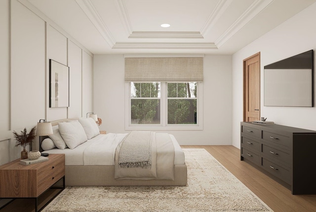 606 Hampton Ave, Tallahassee, FL 32310 - bedroom with light wood finished floors, a tray ceiling, and crown molding