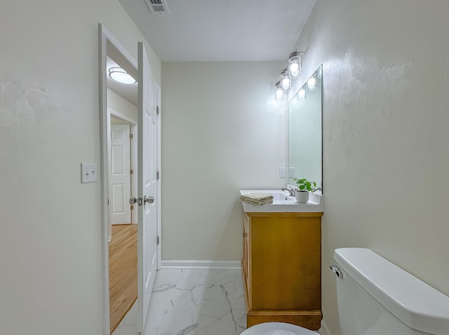 804 Medical Commons Ct, Tallahassee, FL 32310 - half bath with visible vents, baseboards, marble finish floor, toilet, and vanity