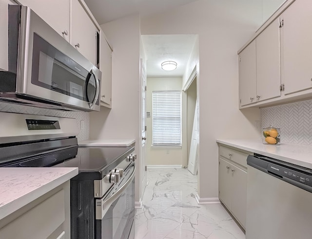 804 Medical Commons Ct, Tallahassee, FL 32310 - kitchen with marble finish floor, tasteful backsplash, light countertops, and appliances with stainless steel finishes