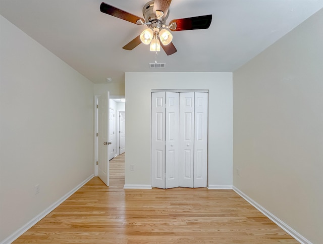 804 Medical Commons Ct, Tallahassee, FL 32310 - unfurnished bedroom featuring light wood-style flooring, baseboards, visible vents, a ceiling fan, and a closet