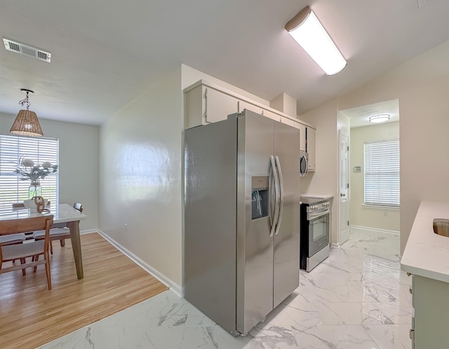 804 Medical Commons Ct, Tallahassee, FL 32310 - kitchen featuring light countertops, visible vents, baseboards, marble finish floor, and appliances with stainless steel finishes