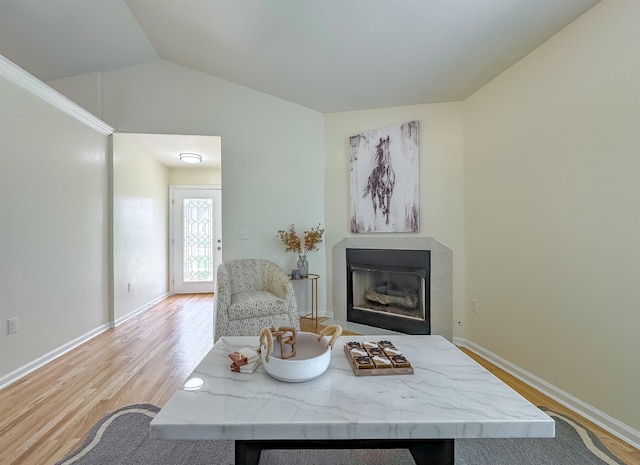 804 Medical Commons Ct, Tallahassee, FL 32310 - living area with baseboards, a fireplace, wood finished floors, and vaulted ceiling
