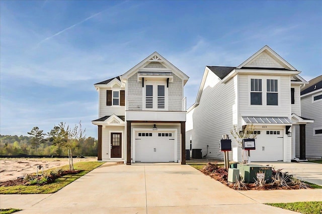 8372 Bull Headley Rd, Tallahassee, FL 32312 - view of front of home featuring an attached garage, concrete driveway, and central air condition unit