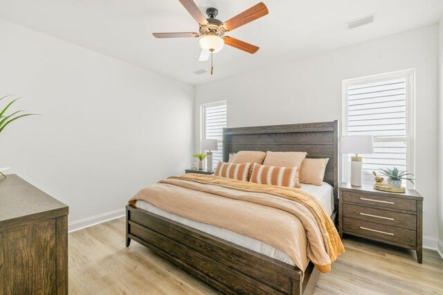 8372 Bull Headley Rd, Tallahassee, FL 32312 - bedroom with light wood finished floors, baseboards, and a ceiling fan