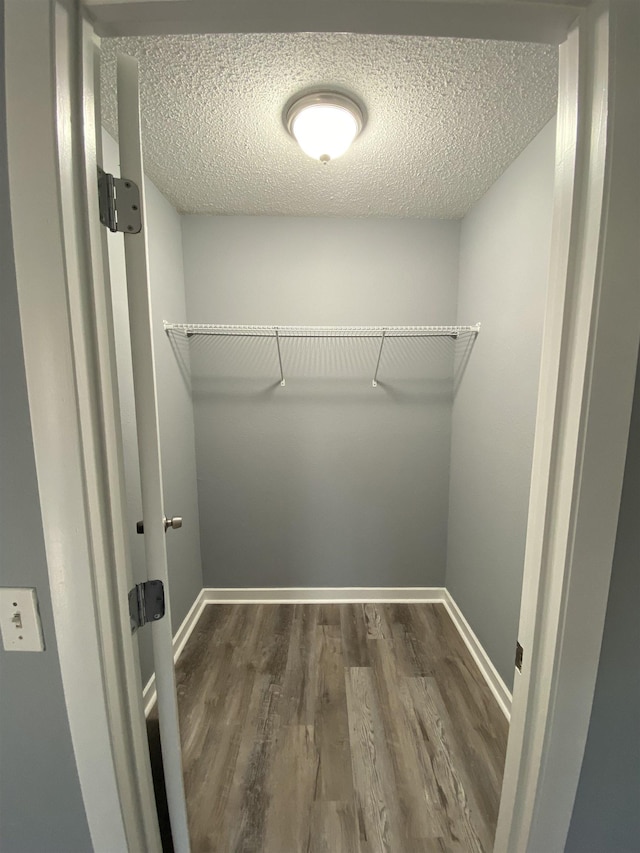 4350 Fortner Cir, Perry, FL 32347 - walk in closet with dark wood-style floors