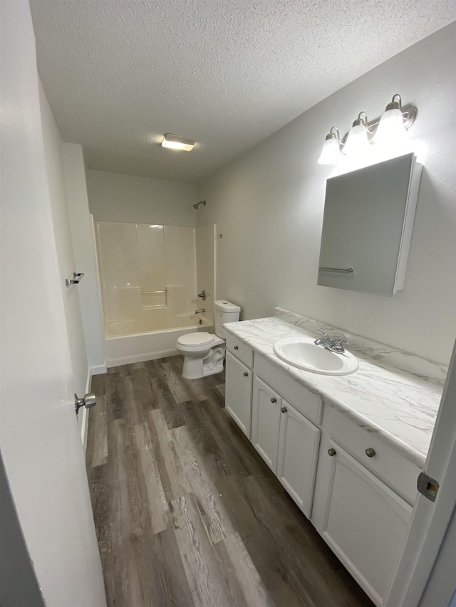 4350 Fortner Cir, Perry, FL 32347 - bathroom featuring vanity, a textured ceiling, wood finished floors, and shower / bath combination