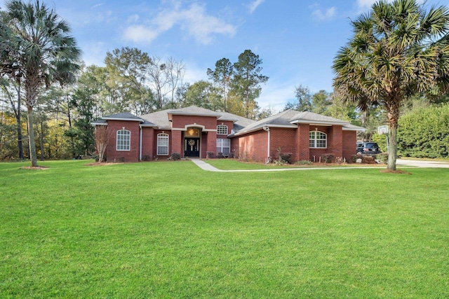 ranch-style home with a front lawn