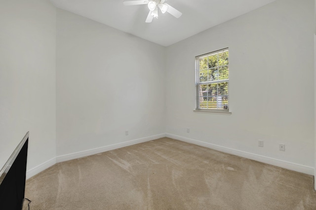 empty room with light carpet and ceiling fan