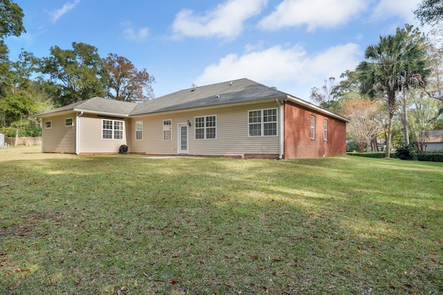 back of house with a yard