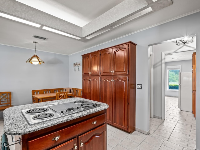 kitchen featuring a center island, hanging light fixtures, crown molding, white appliances, and light tile patterned floors