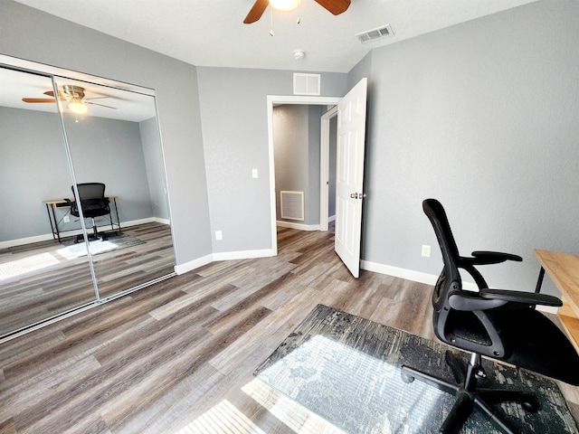 office with ceiling fan and wood-type flooring