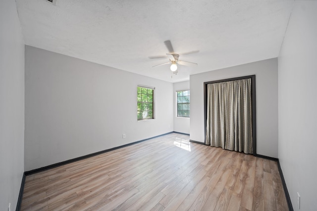 2401 Hideaway Ct, Tallahassee, FL 32303 - unfurnished bedroom featuring ceiling fan, baseboards, and light wood finished floors